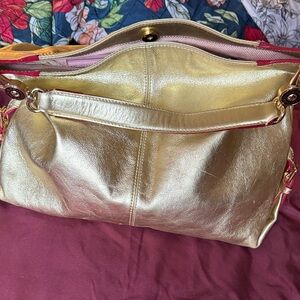 Dooney & Bourke Gold Metallic Logo Lobster Claw Shoulder Hobo Handbag